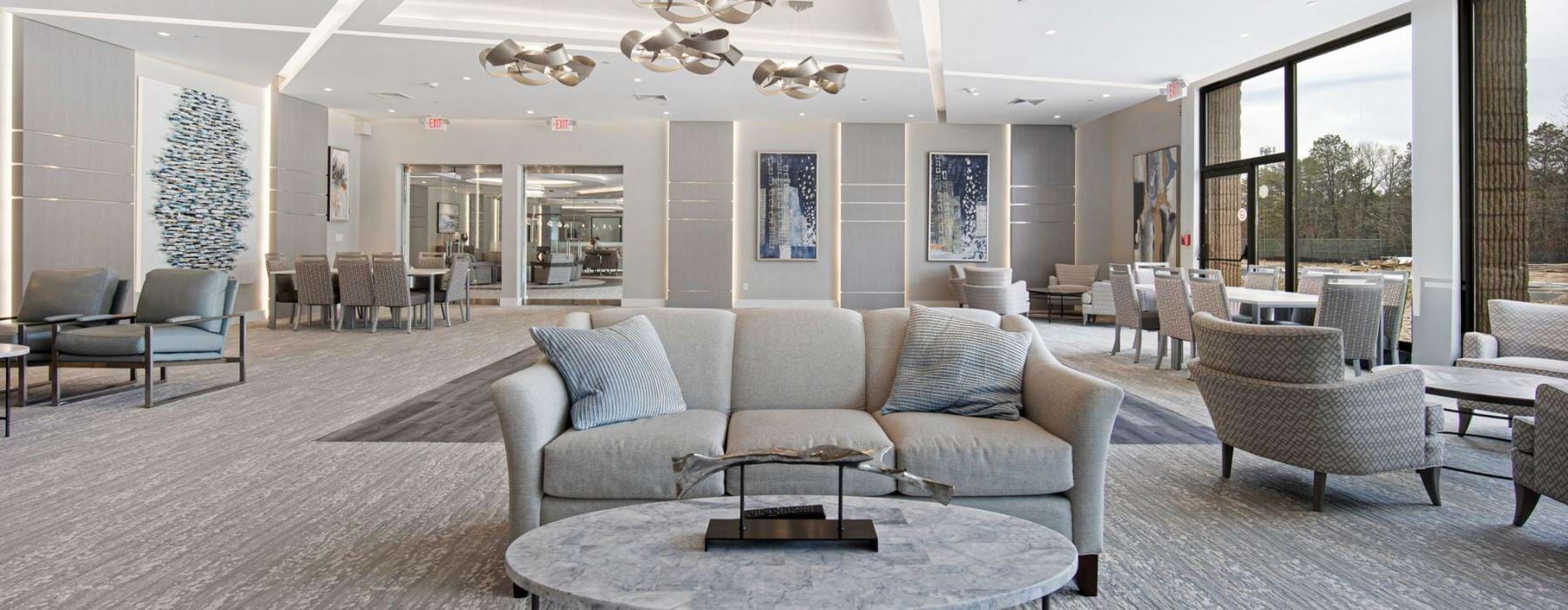 a large room with a large chandelier and a large glass door